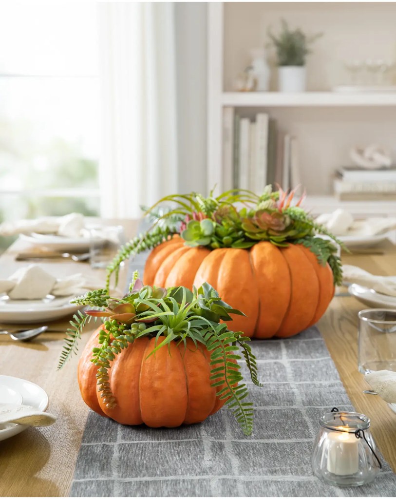 Fall succulent and pumpkin centerpiece on a set table