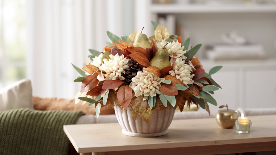 Fall faux floral arrangement on a console table