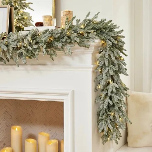 Product styling white Christmas flocked garland on a fireplace